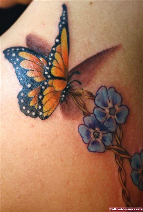 Blue Flower And Butterfly Tattoo