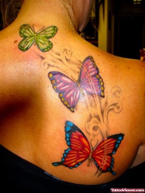 Beautiful Colored Ink Butterflies Tattoo On Back Shoulder