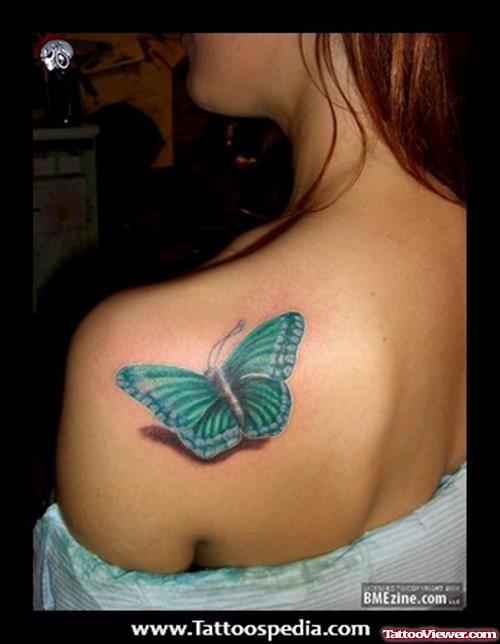Blue Ink Butterfly Tattoo On Girl Left Back Shoulder