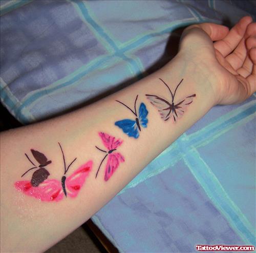 Colored Butterfly Tattoos On Left Forearm
