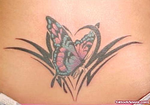 Tribal And Butterfly Tattoo On Lowerback