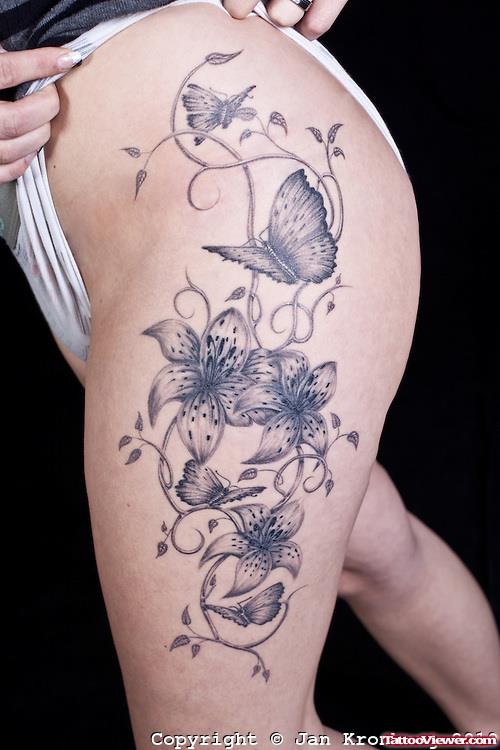 Grey Lily Flowers And Butterfly Tattoo On Half Sleeve