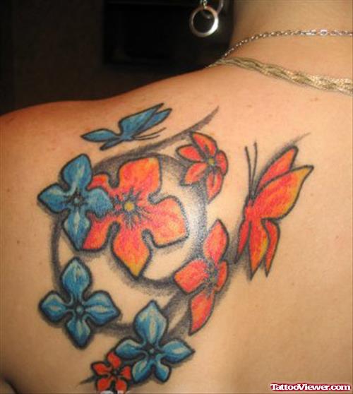 Blue Ink Flowers And Colored Butterfly Tattoo On Left Back Shoulder