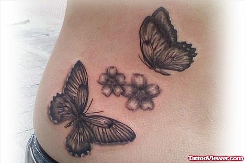 Grey Ink Butterflies And Flowers Tattoo On Side