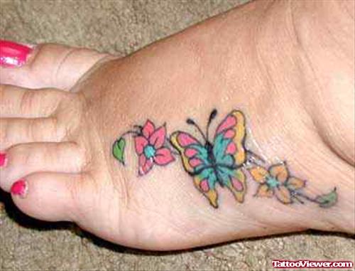 Flowers And Colored Butterfly Tattoo On Left Hand