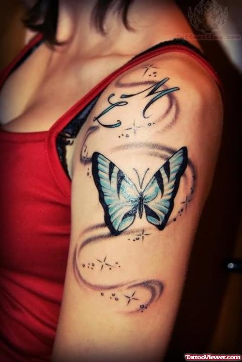 Blue Butterfly Tattoo On Biceps