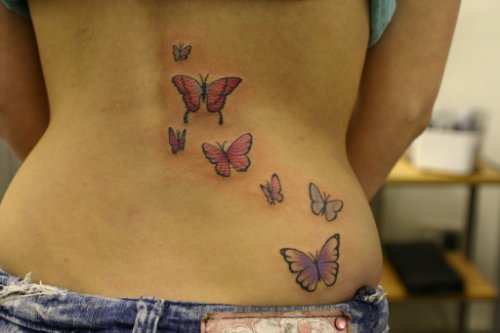 Colored Butterfly Tattoos On Lowerback
