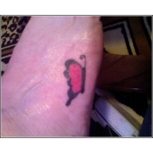 Red Butterfly Tattoo On Foot
