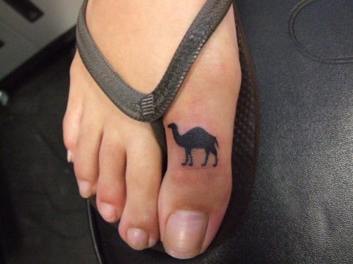 Girl Showing Camel Tattoo On Her Right Toe