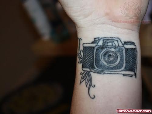 Unique Black Ink Camera Tattoo On Wrist