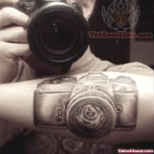 Grey Ink Camera Tattoo On Arm