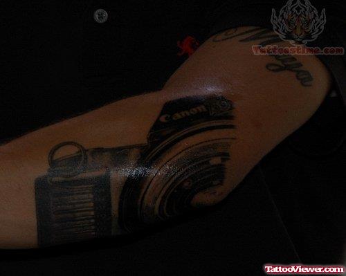 Camera Shutter Tattoo On Elbow