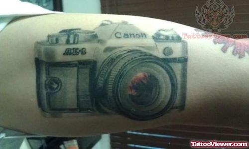 Canon Camera Tattoo On Muscle
