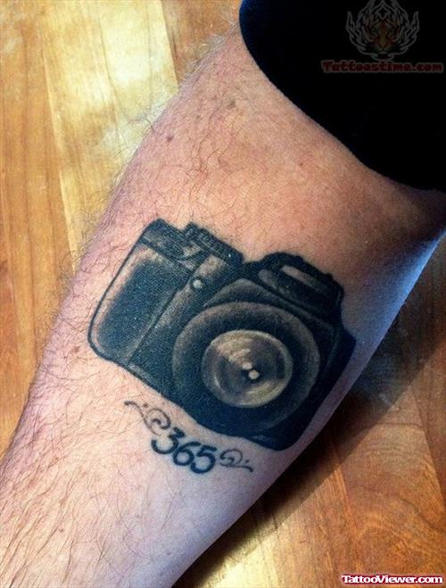 Numbered Camera Tattoo On Arm