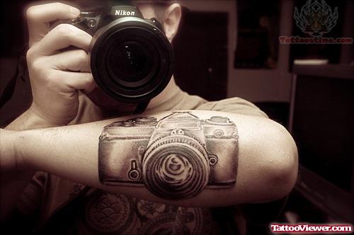 Nikon Camera Tattoo On Boy Arm