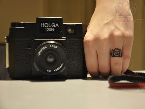 Camera Tattoo On Left Hand Finger