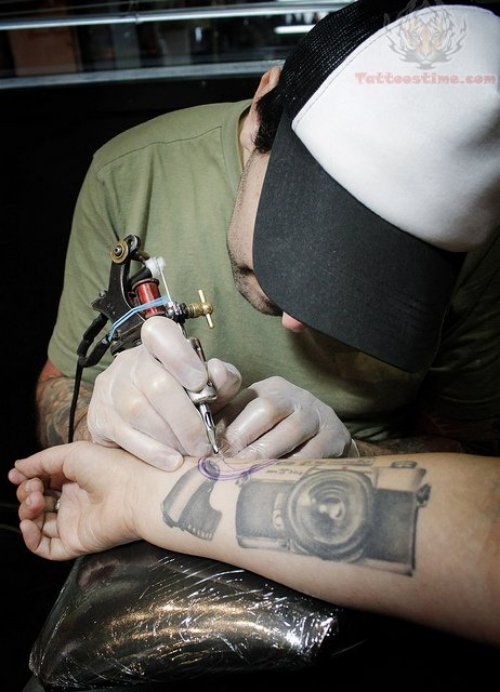 Camera Tattoo On Wrist In Process