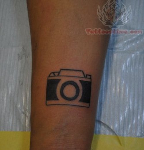Small Camera Tattoo On Arm