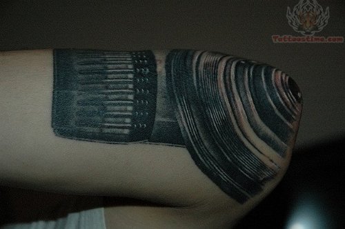Black Ink Camera Tattoo On Elbow