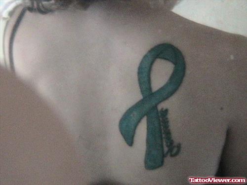 Green Ink Ribbon Cancer Tattoo On Back Shoulder