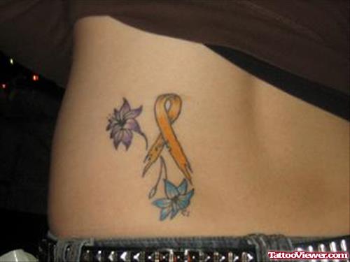 Flowers And Ribbon Cancer Tattoo On Lowerback