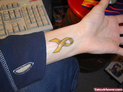 Yellow Ribbon Cancer Tattoo On Left Forearm