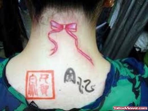Pink Bow Ribbon Cancer Tattoo On Nape