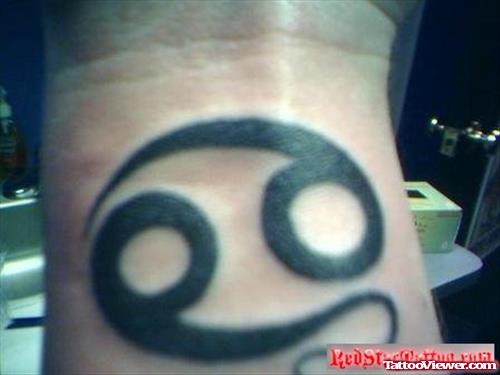 Black Ink Cancer Tattoo On Wrist