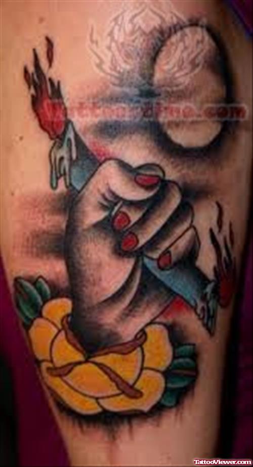 Hand Holding Candle Tattoo