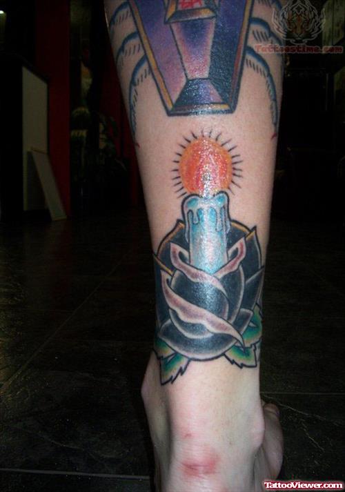 Flower Candle Tattoo On Back Leg
