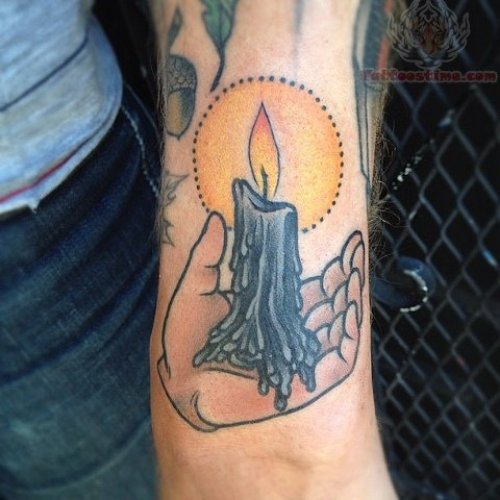 Flaming Candle In Hand Tattoo On Arm