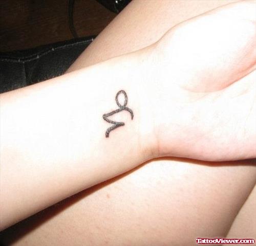 Tiny Capricorn Zodiac Tattoo On Wrist