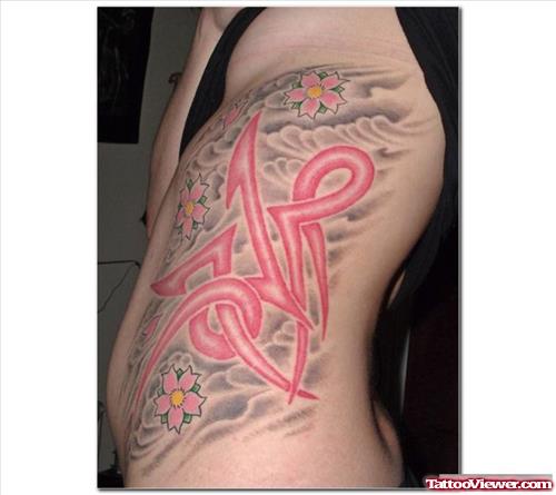 Red Ink Tribal Capricorn Tattoo On Side Rib