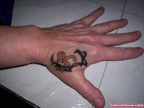 Tribal And Capricorn Tattoo On Left Hand