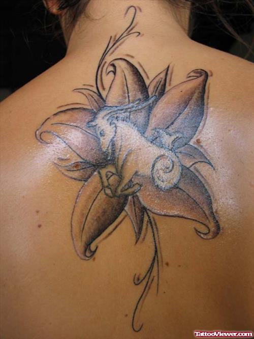 Grey Ink Flower And Capricorn Tattoo On Back