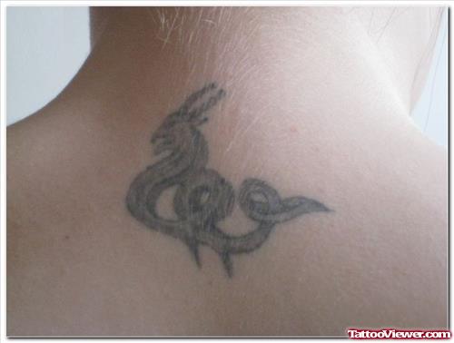 Grey Ink Capricorn Tattoo On Upperback