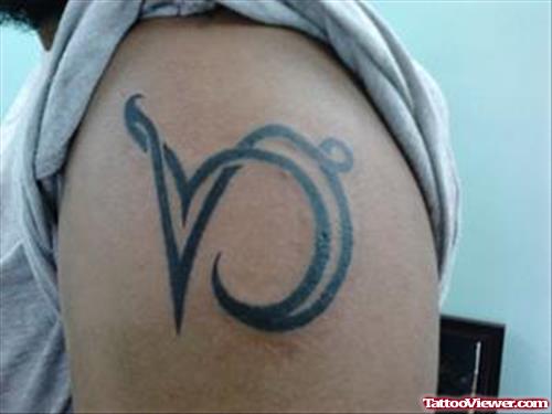 Attractive Black Ink Tribal Capricorn Tattoo On Shoulder