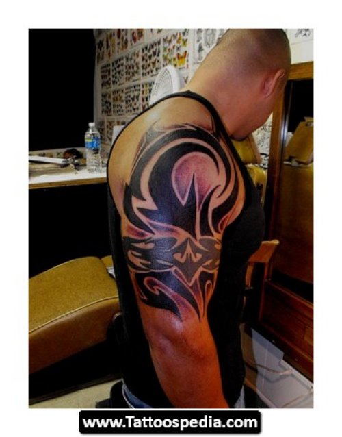 Attractive Tribal Capricorn Tattoo On Man Right Half Sleeve