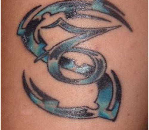Blue And Black Tribal Capricorn Zodiac Tattoo