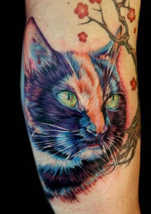 Colored Cat Head Tattoo On Inner Bicep
