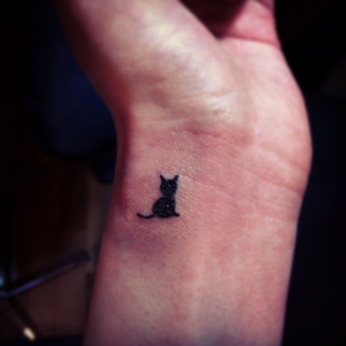 Best Black Ink Cat Tattoo On Left Wrist