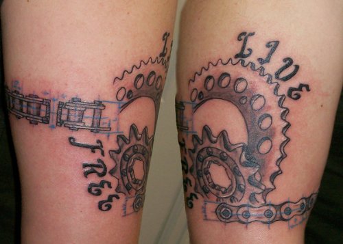 Nice Grey Ink Sprocket And Chain Tattoo