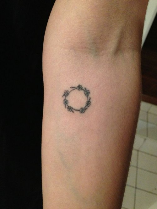hand poked daisy Chain Tattoo On Forearm