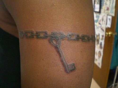 Key And Chain Tattoo On Bicep