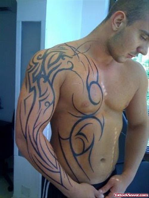 Black Ink Tribal Chest And Sleeve Tattoo