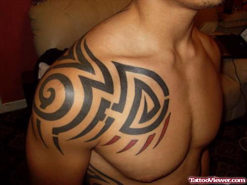 Black And Red Ink Tribal Chest Tattoo