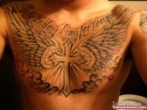 Grey Ink Religious Cross Winged Chest Tattoo