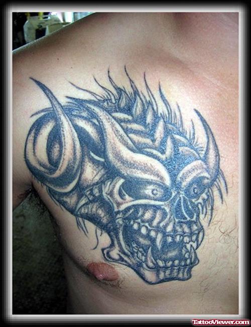 Grey Ink Devil Skull Chest Tattoo