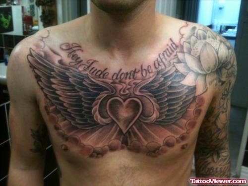 Grey Ink Winged Heart Chest Tattoo For Men