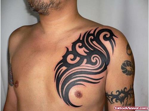 Amazing Black Ink Tribal Chest Tattoo For Men